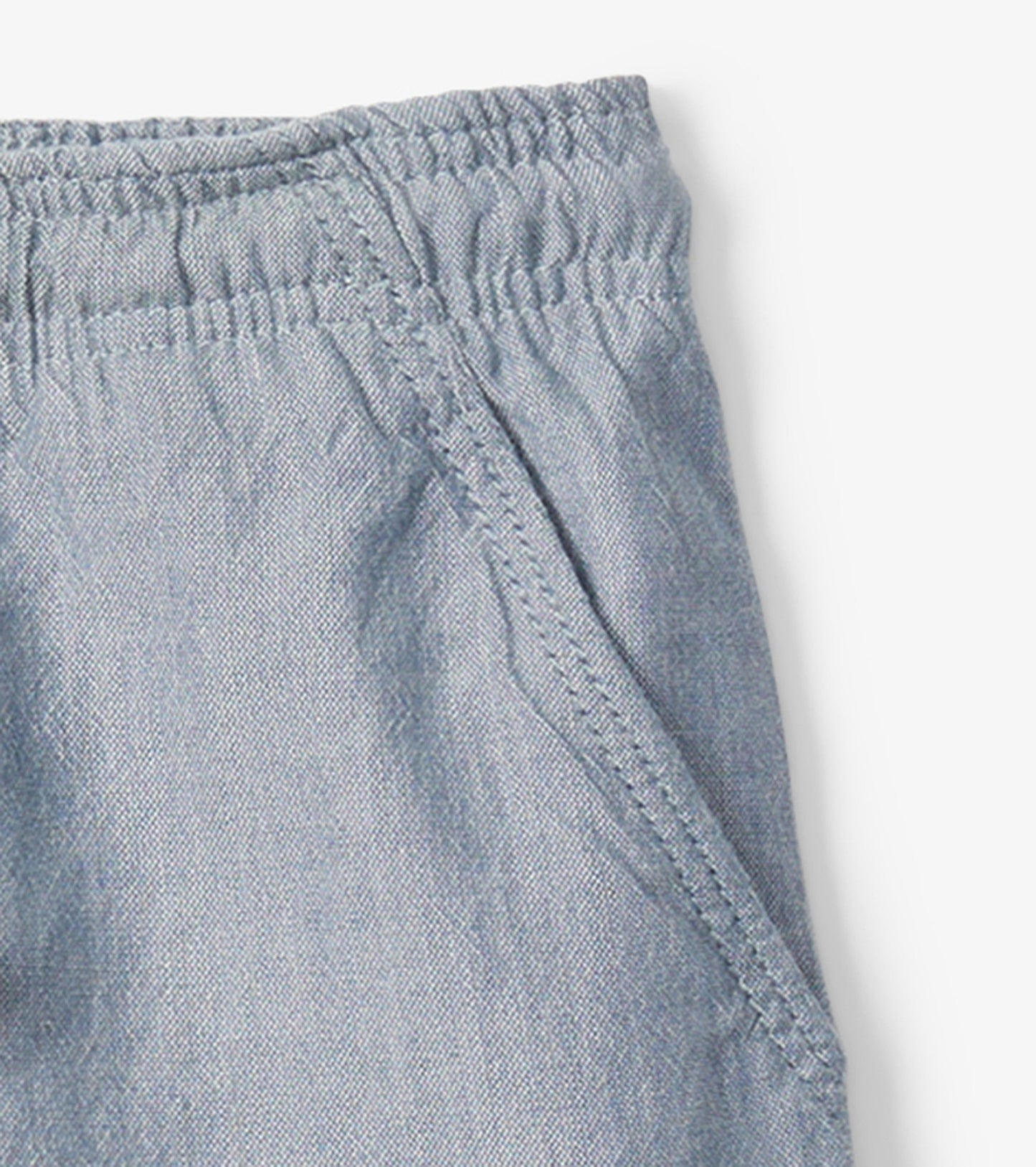 Light blue chambray pull-on shorts for baby and toddler boys, featuring an elastic waistband and side pockets.