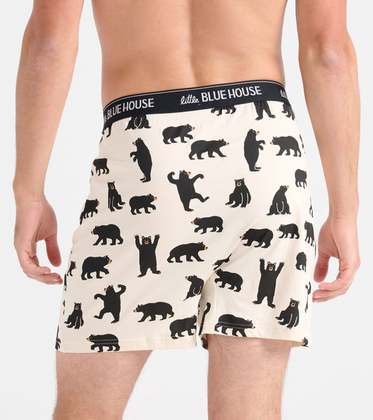 Men's boxer shorts featuring a playful black bear pattern on a cream background, with a comfortable elastic waistband.