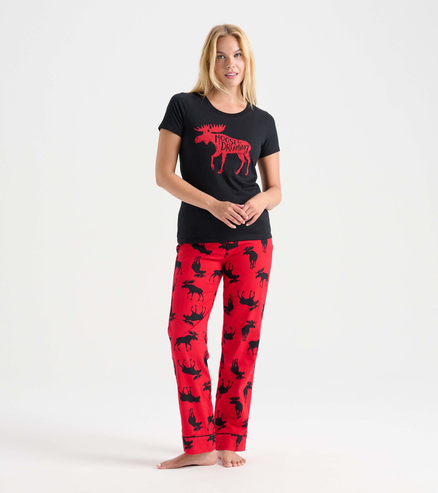 Black pajama t-shirt with red moose graphic paired with red pants featuring black moose silhouettes.