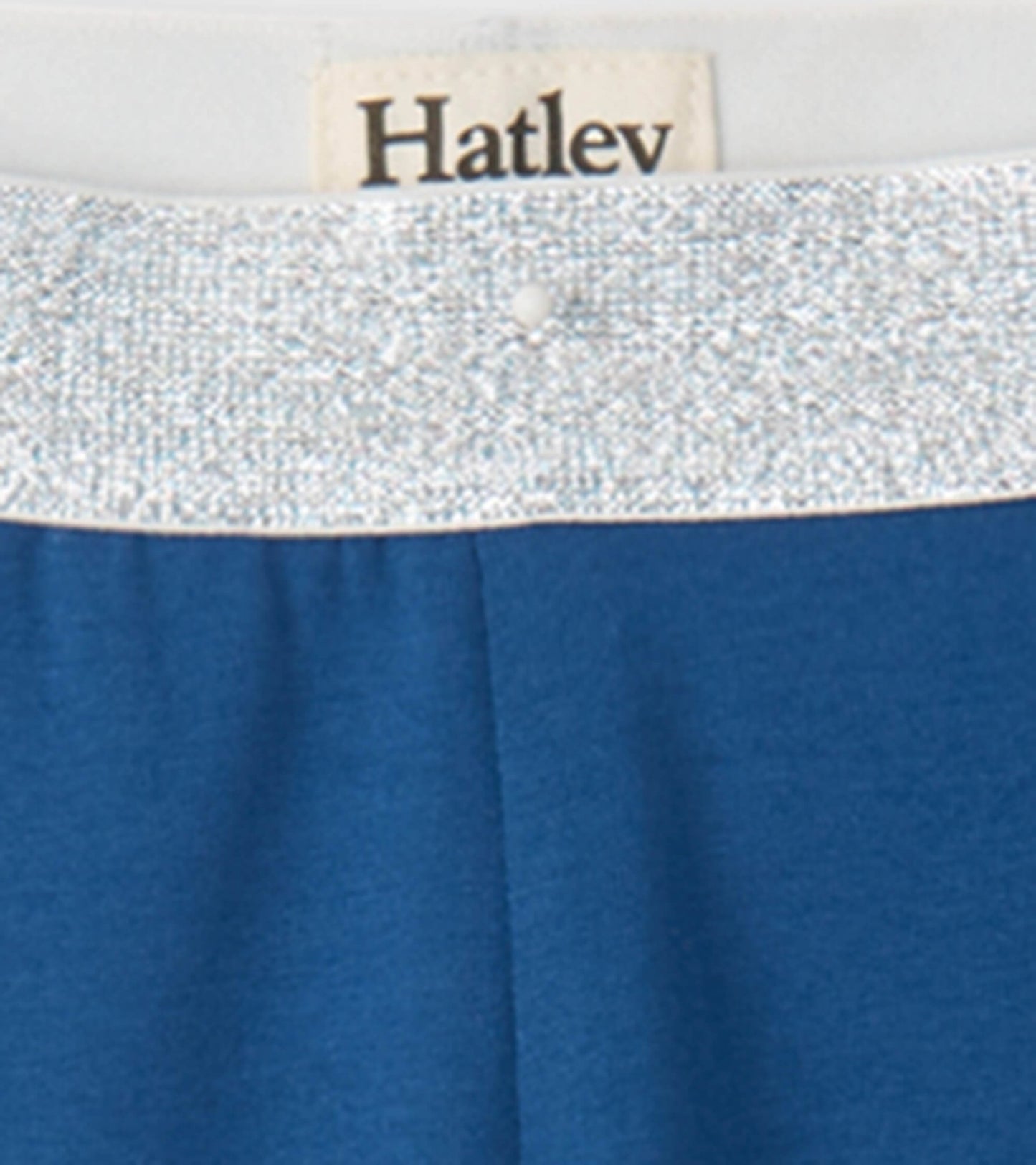 Blue leggings featuring a sparkly silver waistband, designed for girls, suitable for casual wear.