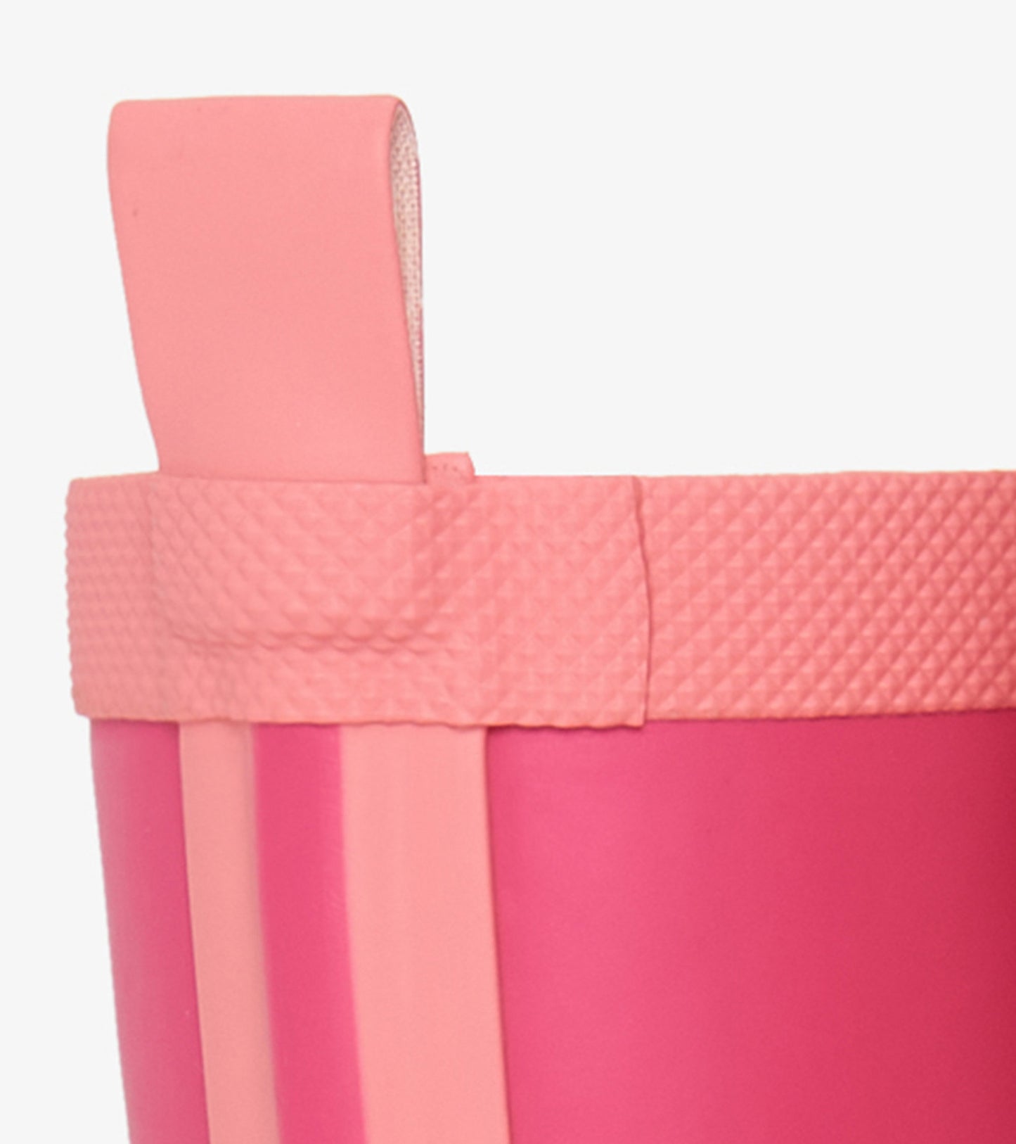 Pink matte rain boot with a textured band and pull tab, designed for kids. Ideal for wet weather play.