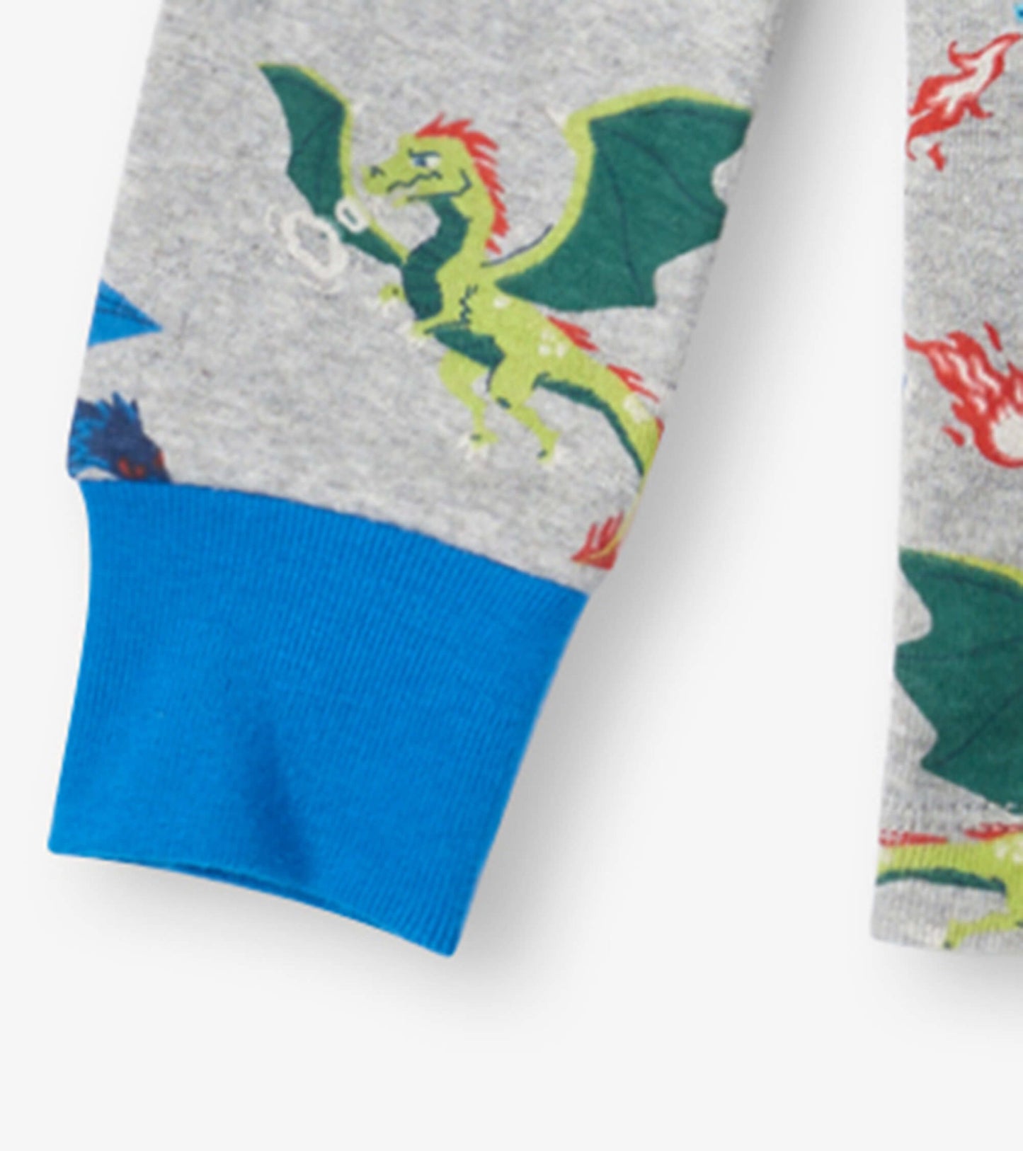 Gray organic cotton pajama set featuring colorful dragon prints and blue cuffs. Ideal for kids' bedtime wear.