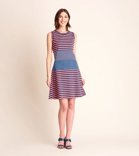 Sleeveless dress featuring navy and coral stripes, flared skirt, and a round neckline, styled with blue sandals.