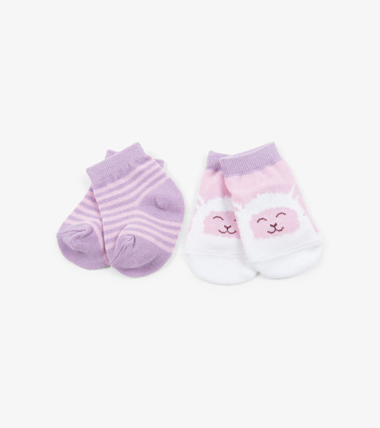 Two pairs of baby socks: one lavender striped and one pink with a sheep design, both in soft cotton material.