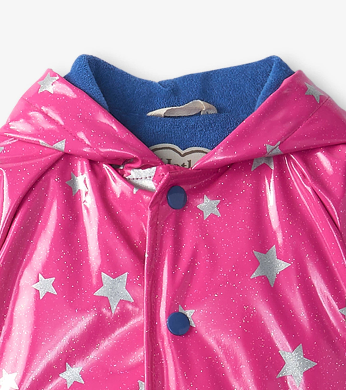 Pink shiny baby raincoat with silver glitter stars and a blue hood lining, featuring blue buttons and a snap closure.