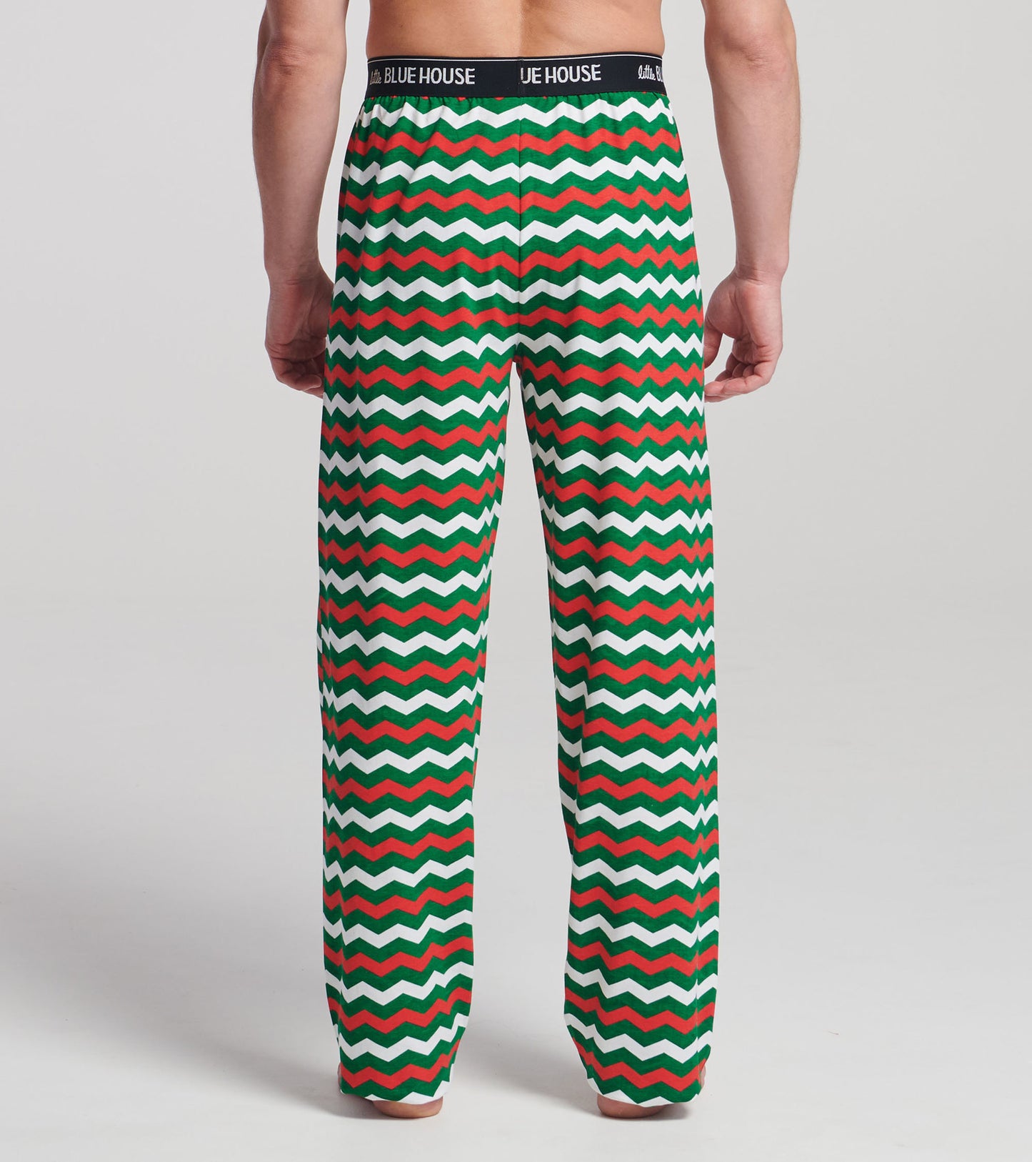 Men's pajama pants featuring a festive zig-zag pattern in red, green, and white, made from stretch cotton.