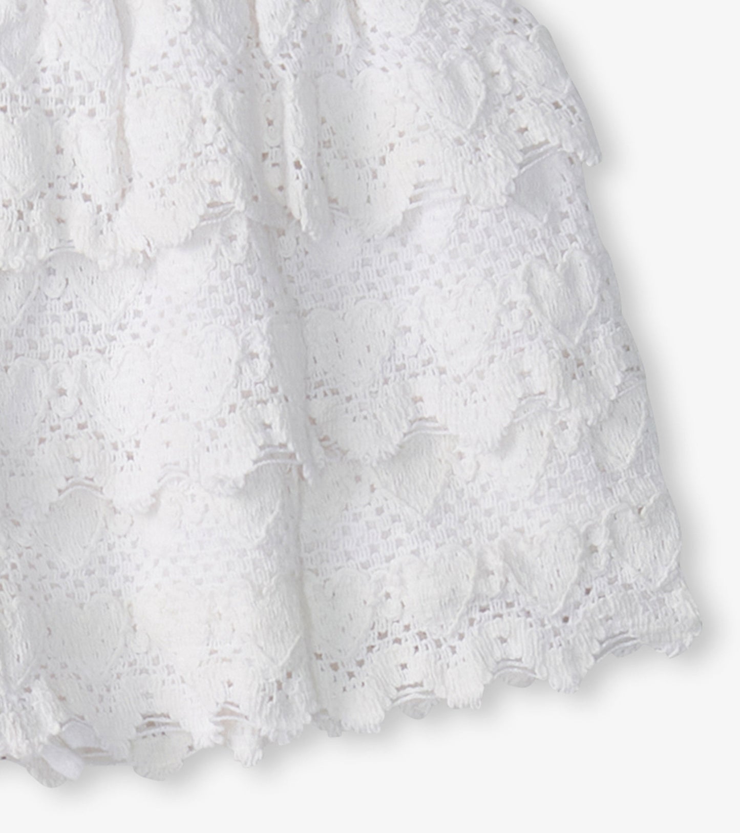 White skort featuring a heart pattern and a floaty design, perfect for casual wear.