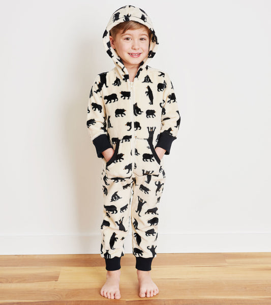 Hooded fleece jumpsuit featuring a cream background with black bear silhouettes, designed for kids.