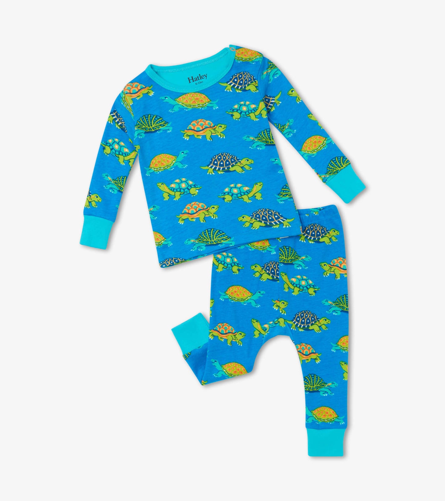 Blue organic cotton baby pajama set featuring colorful turtle patterns, includes long-sleeve top and matching pants.