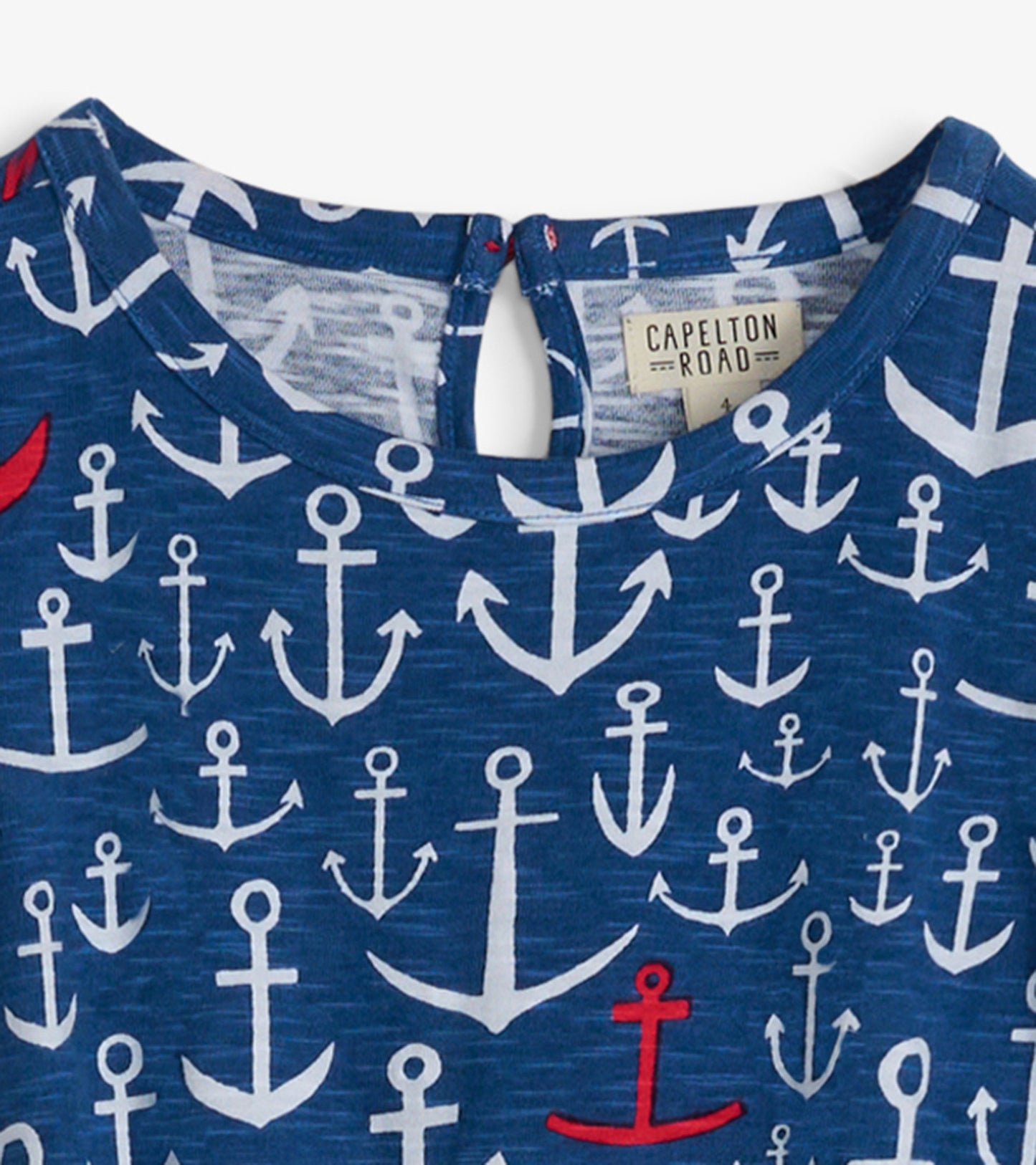 Navy t-shirt dress featuring a pattern of white and red anchors, with a keyhole back detail.