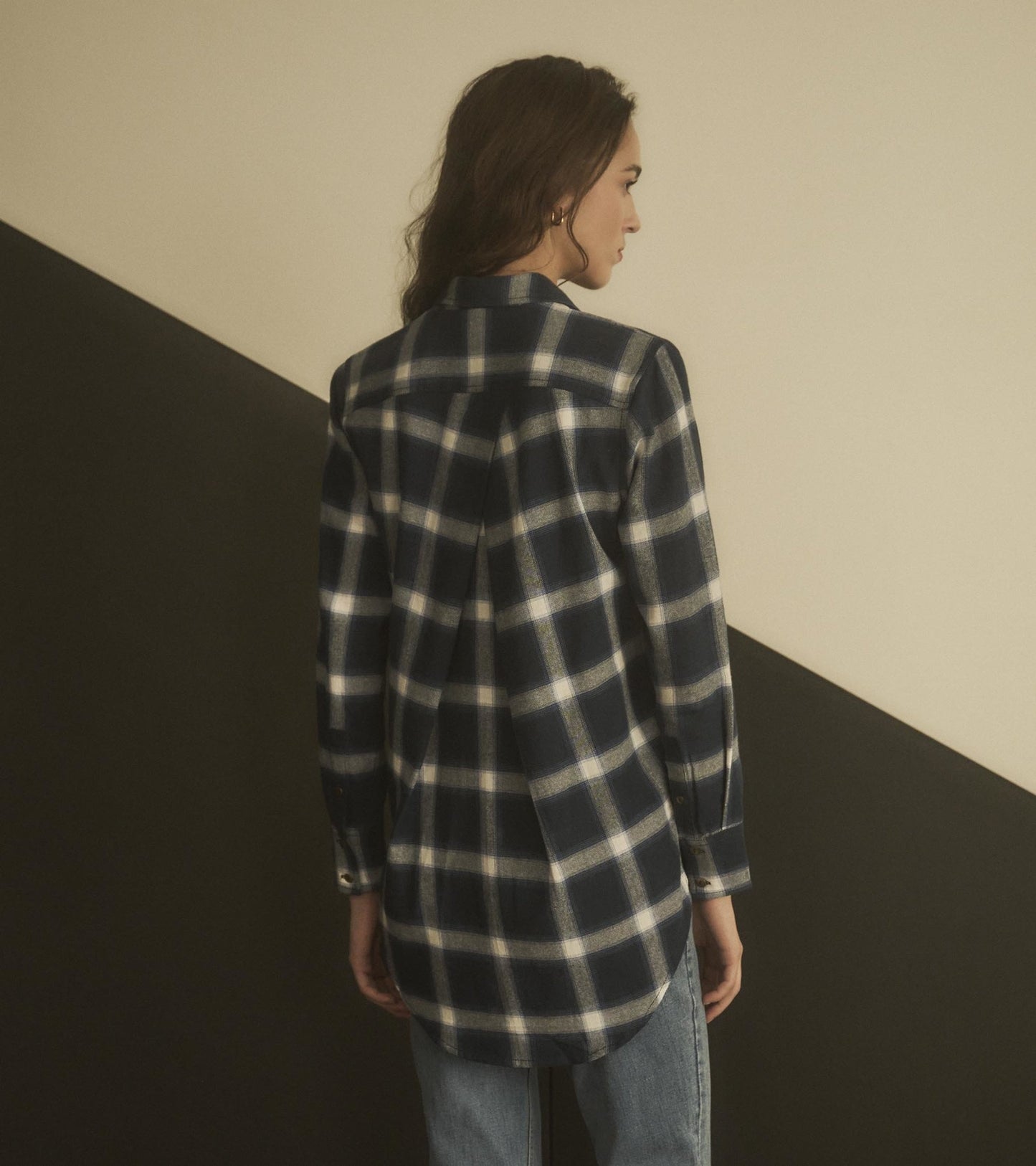 Navy and white plaid tunic with a button-down collar and long sleeves, shown from the back.