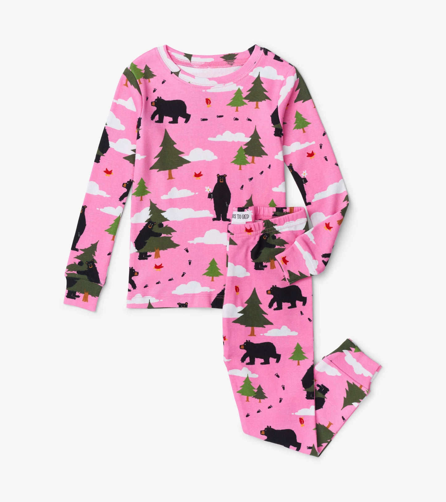 Pink pajama set featuring black bears and trees, made from soft fabric, includes long-sleeve top and matching pants.