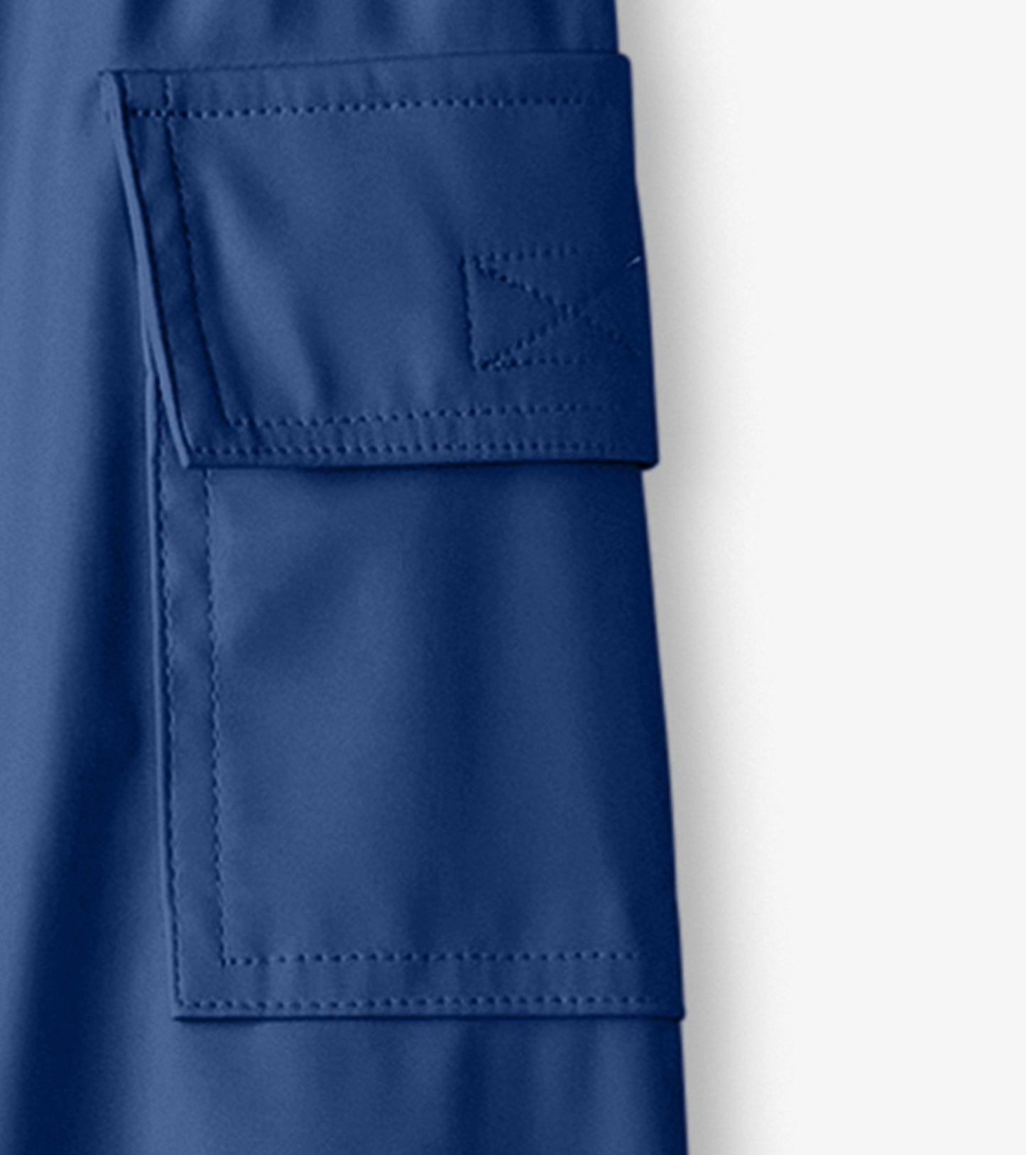 Navy blue kids' rain pants featuring a side pocket and waterproof material, ideal for outdoor play in wet weather.