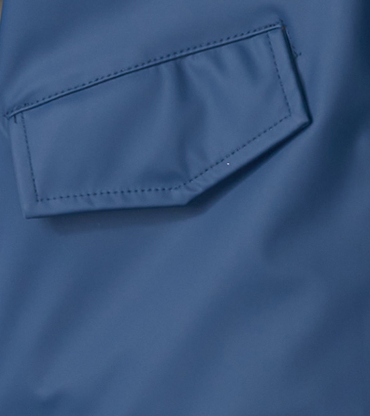 Navy rain jacket with a zip-up front and a pocket detail, suitable for kids.
