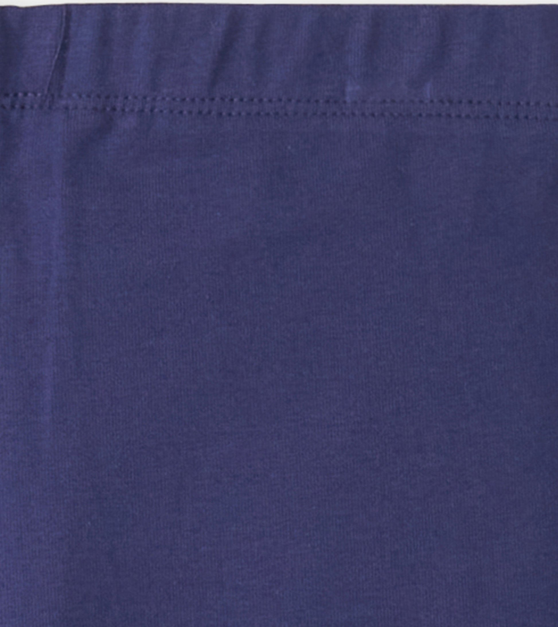 Navy bike shorts made of soft, stretchy fabric with an elastic waistband, suitable for active wear.