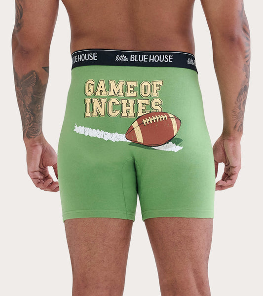 Green boxer briefs featuring a football graphic and "GAME OF INCHES" text on the back.