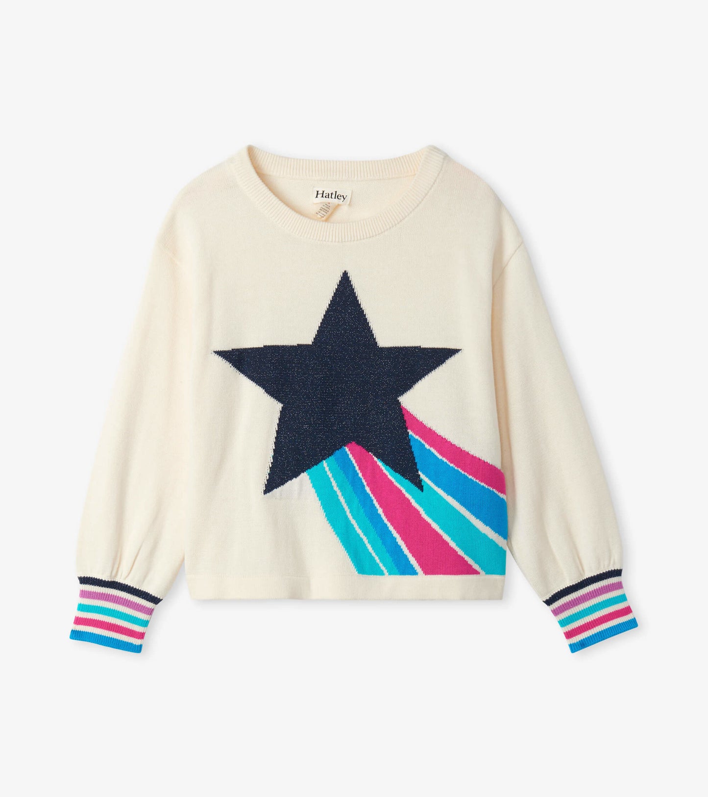 Cream sweater featuring a large navy star and colorful shooting star design, with striped cuffs.