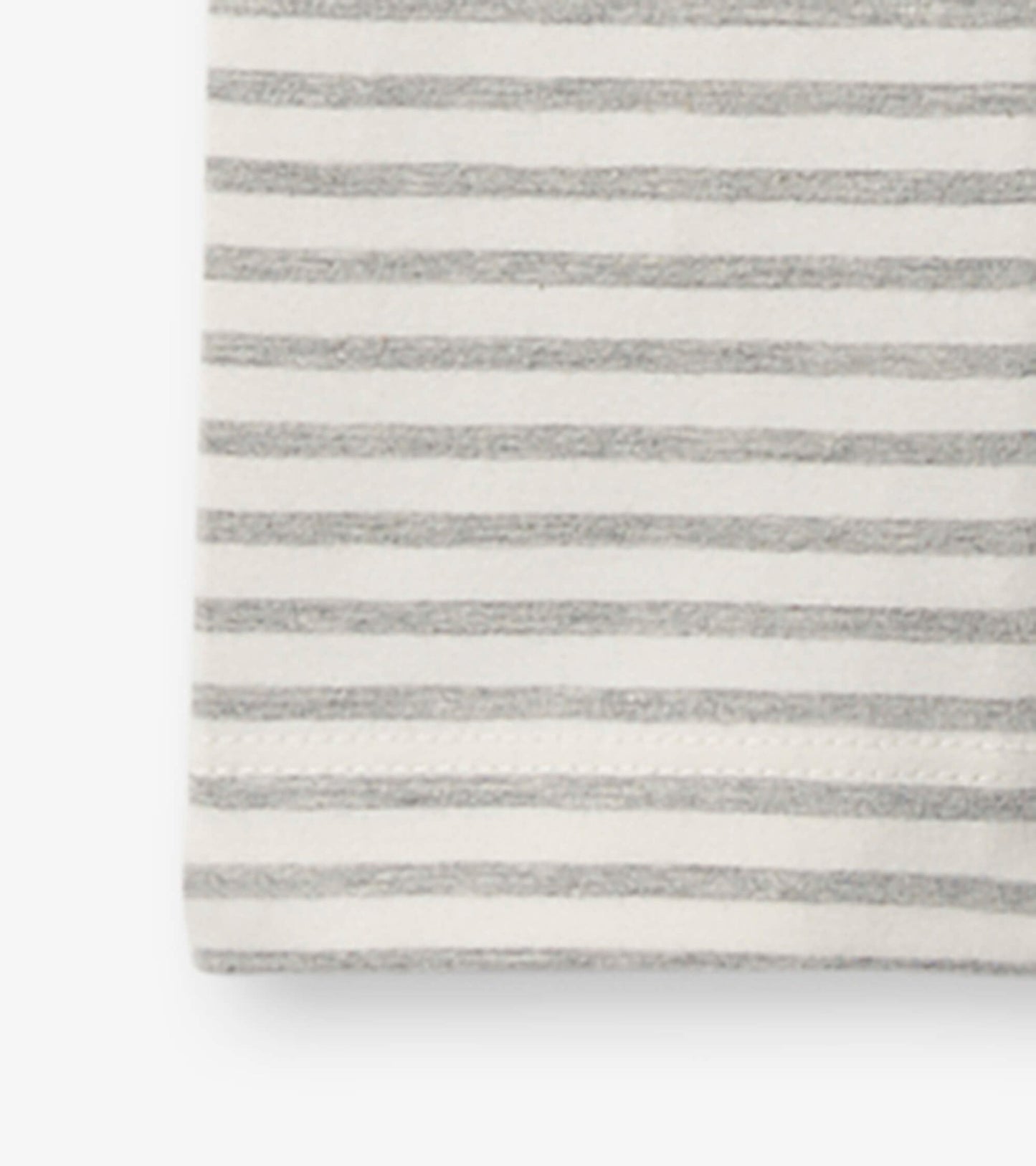 Gray and white striped leggings for girls, featuring a soft material and elastic waistband.