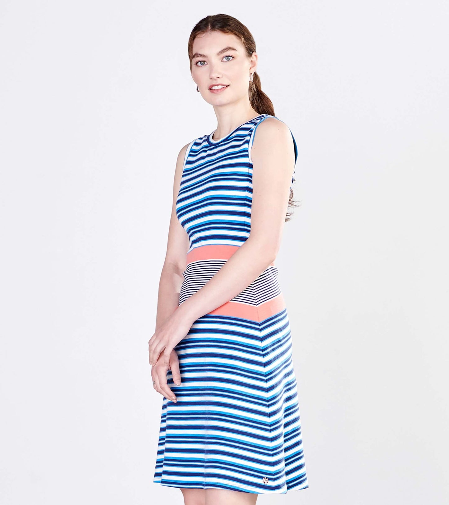 Sleeveless dress featuring blue and white stripes with a coral and black striped waistband, knee-length fit.