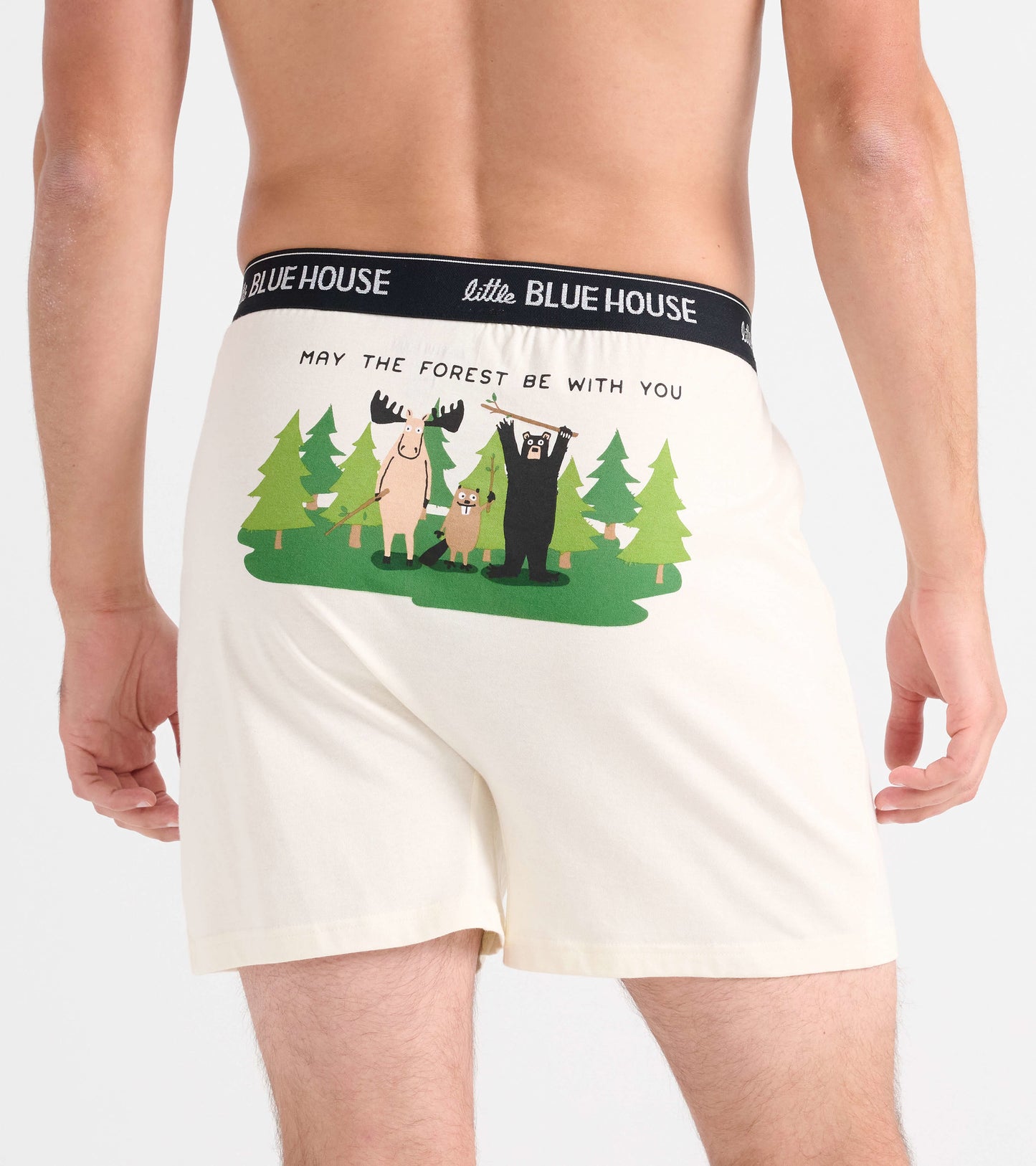 Cream-colored boxer shorts featuring a playful forest animal graphic on the back, with a black waistband.