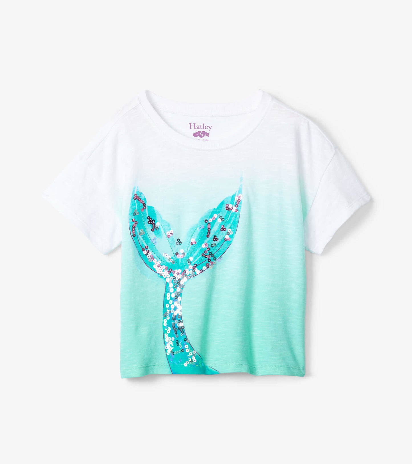 Boxy white tee with a turquoise ombre design and a sequined mermaid tail graphic on the front. Short sleeves.