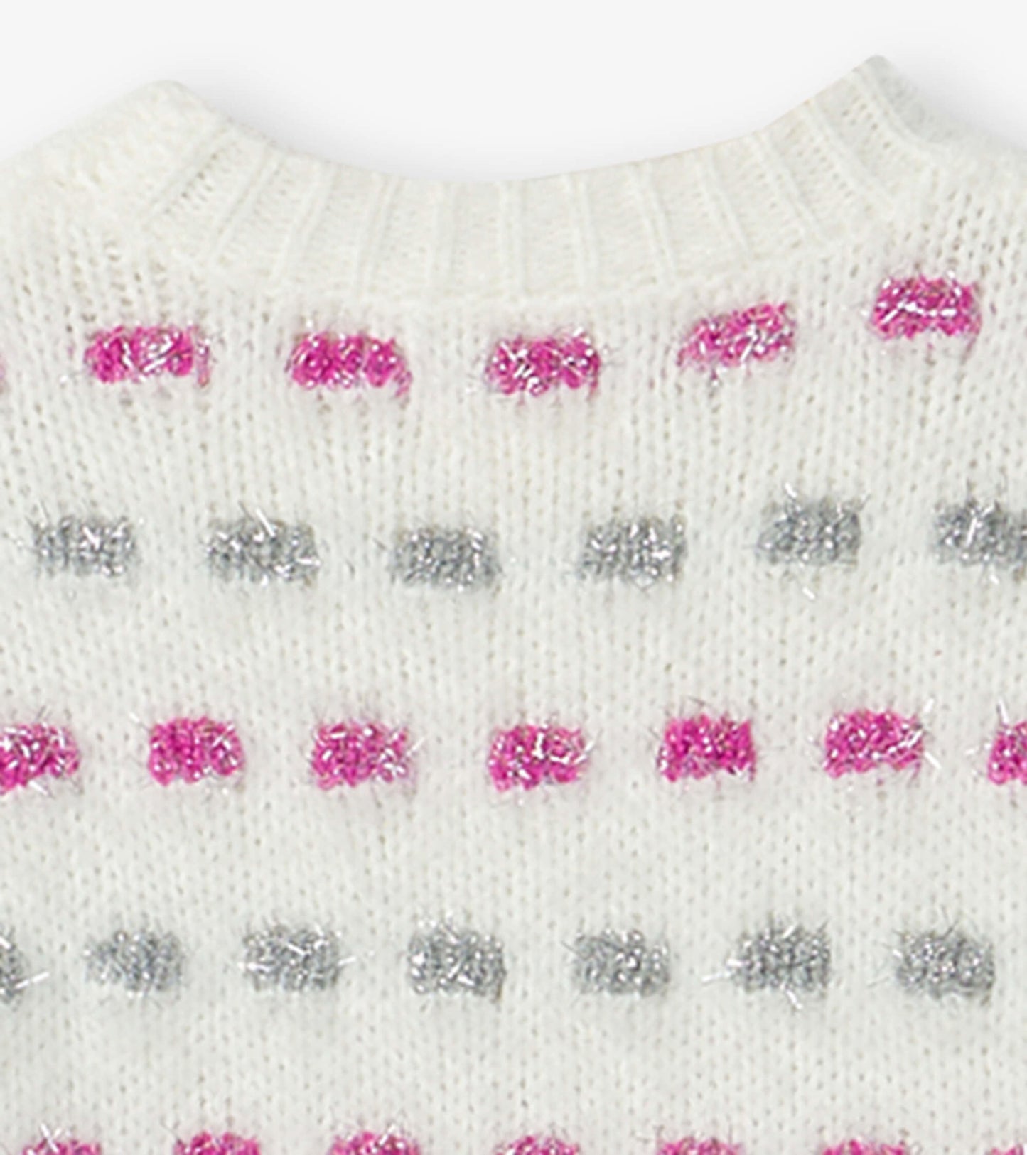 White sweater tunic featuring a basket weave pattern with pink and silver accents. Round neckline and ribbed trim.