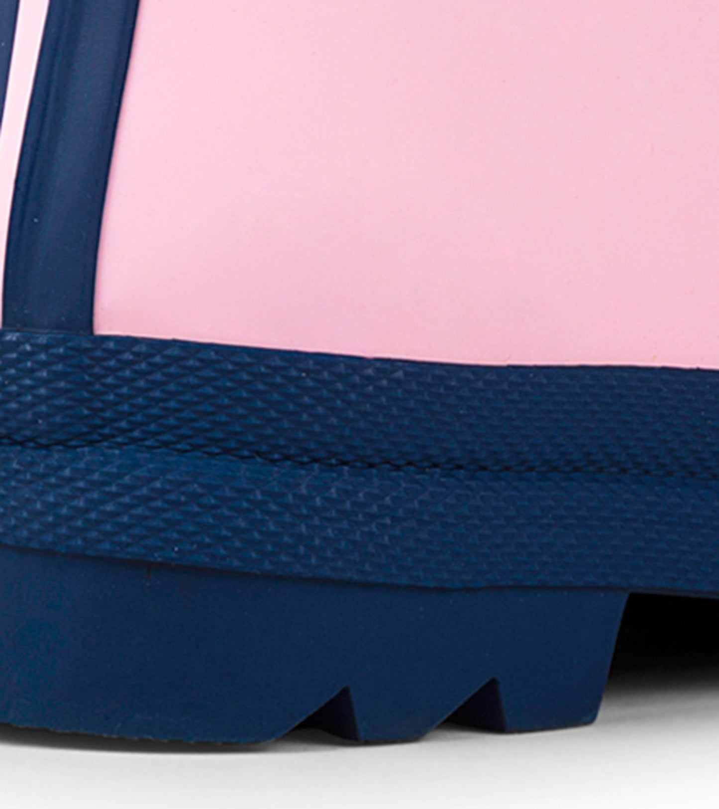Pink and navy matte rain boots with a textured sole, designed for kids, featuring a classic waterproof style.