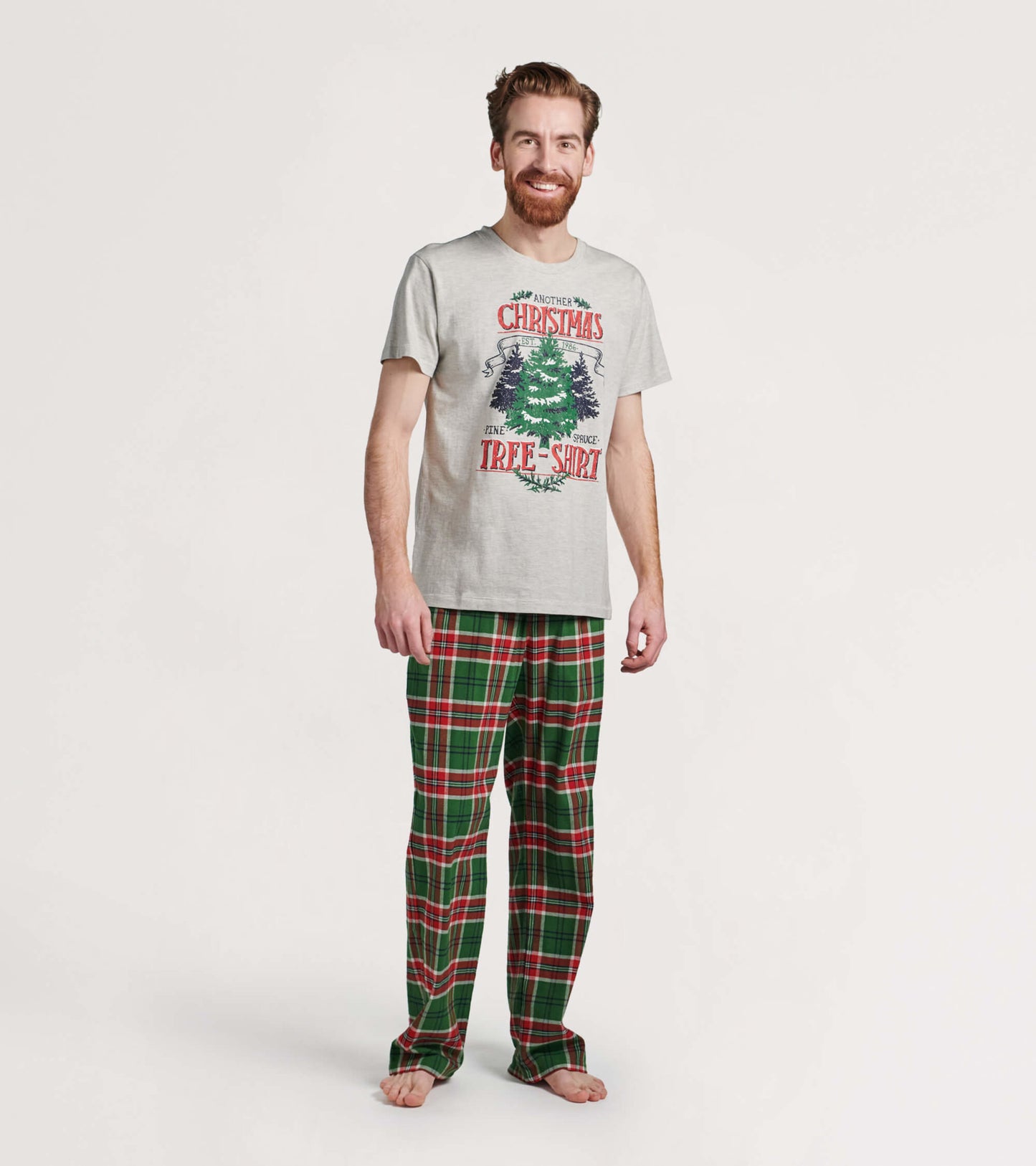 Men's flannel pajama pants featuring a festive red and green plaid pattern, ideal for cozy holiday wear.