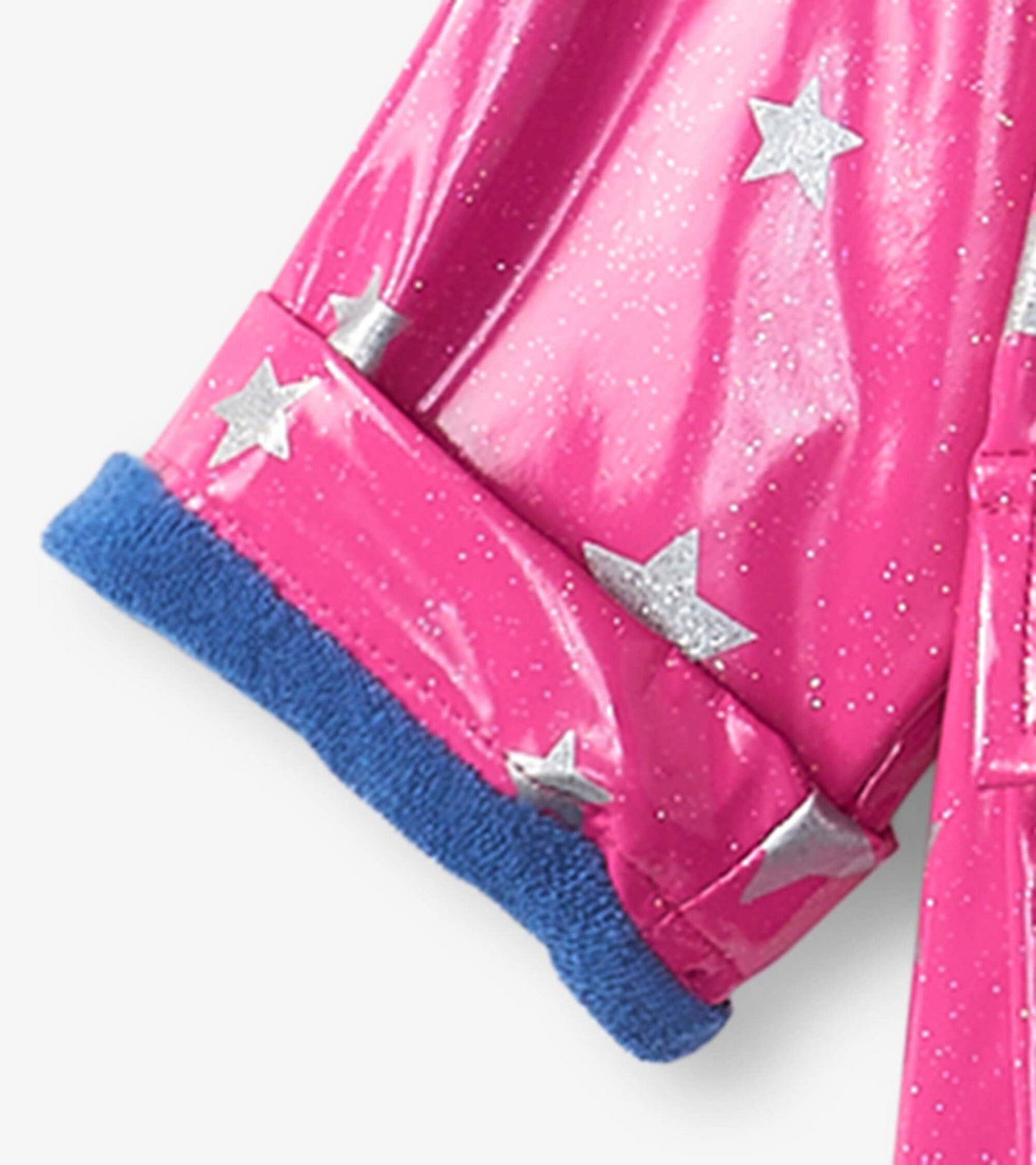 Pink glittery baby raincoat with silver stars and blue fleece cuffs. Suitable for rainy weather.