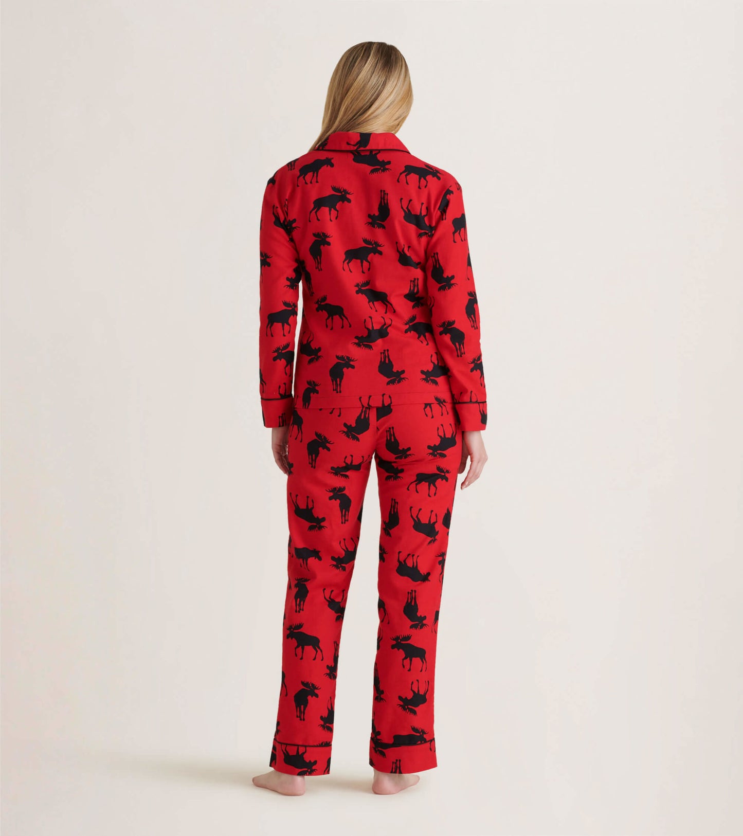 Red flannel pajama set featuring black moose patterns, shown from the back with long sleeves and pants.