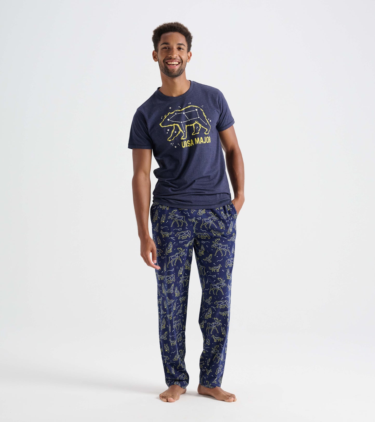 Navy cotton pajama pants featuring animal constellations in yellow, designed for comfort and relaxation.