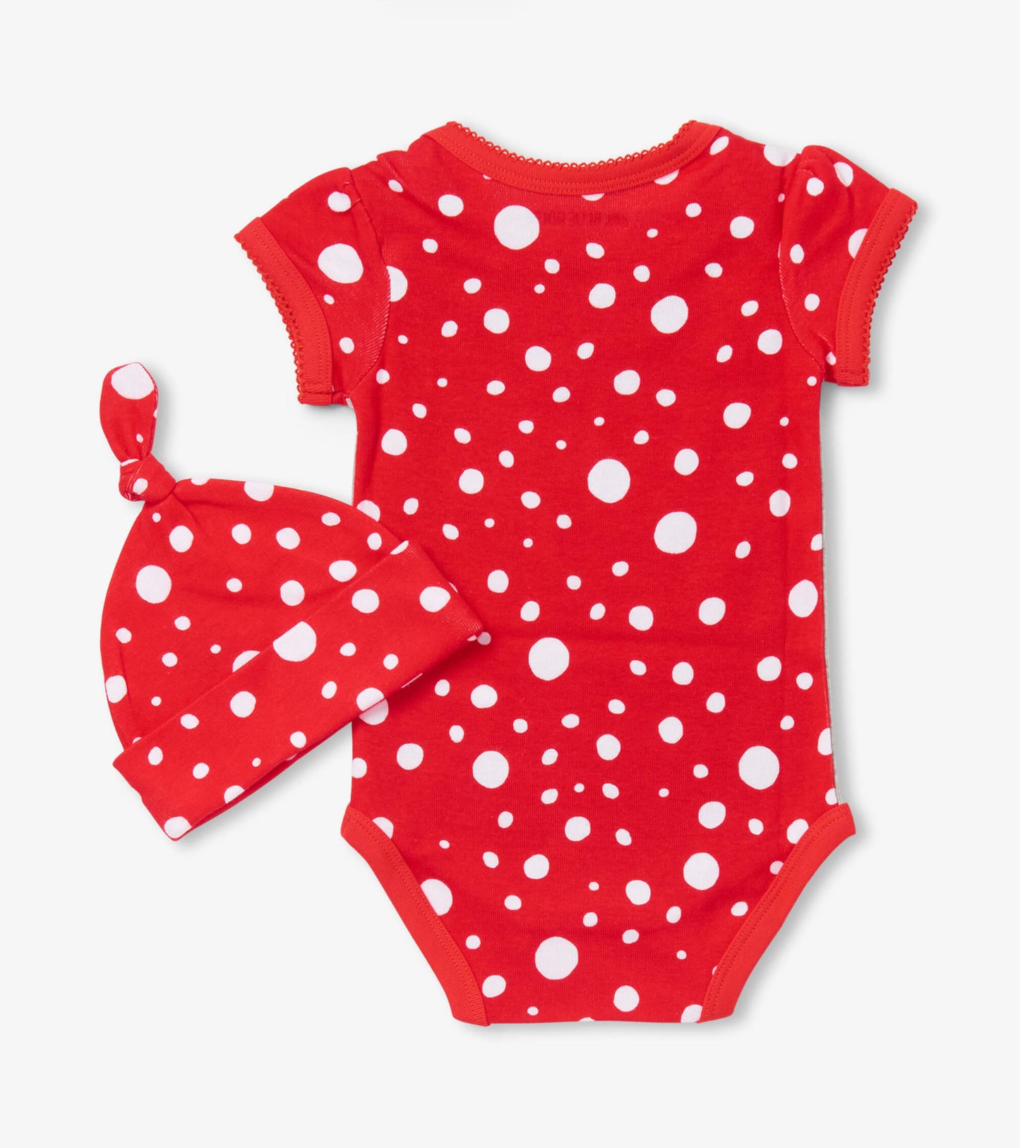 Red short-sleeve bodysuit with white polka dots, paired with a matching hat featuring a knot on top.
