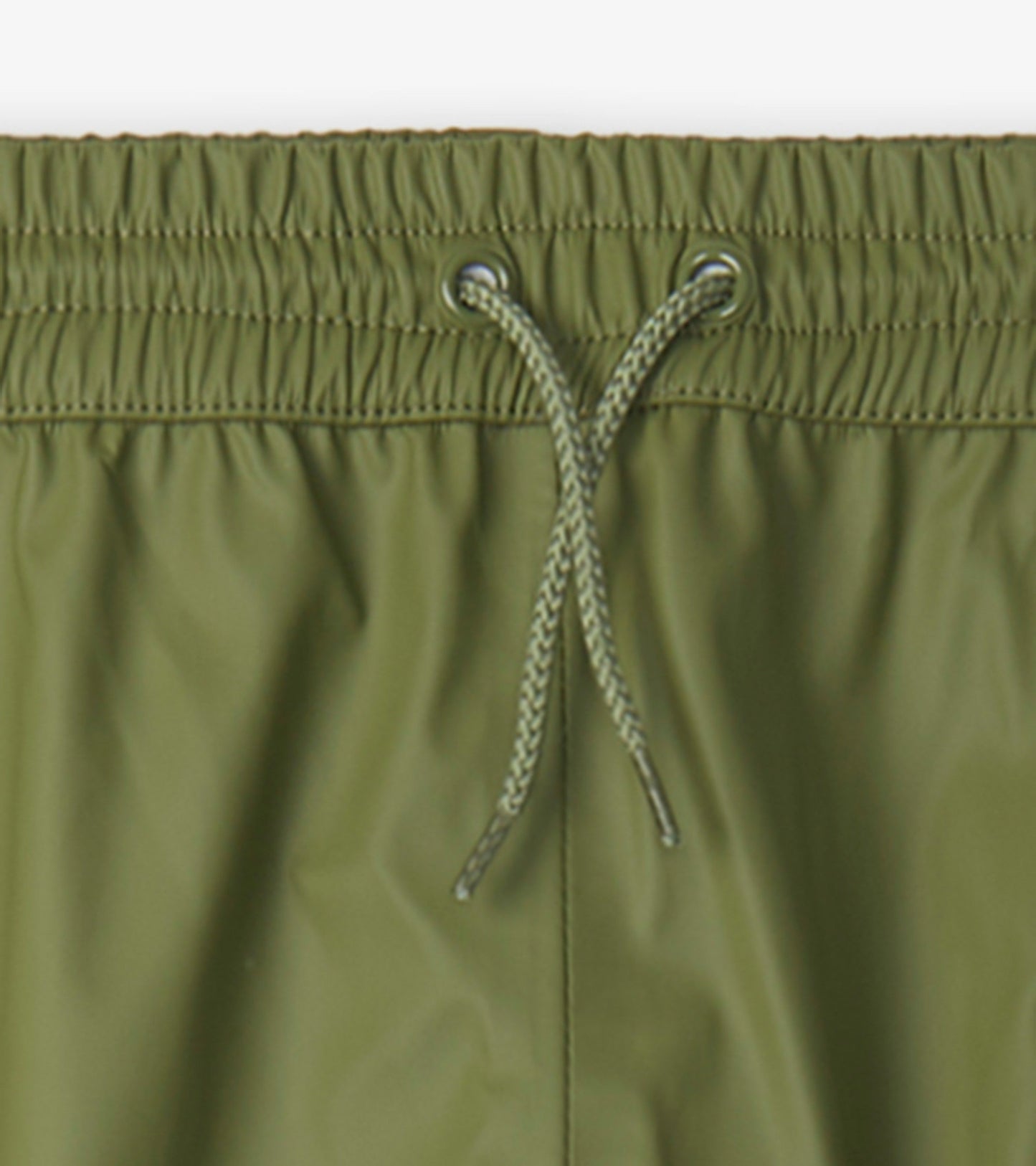 Forest green waterproof kids' rain pants with an elastic waistband and drawstring for adjustable fit.