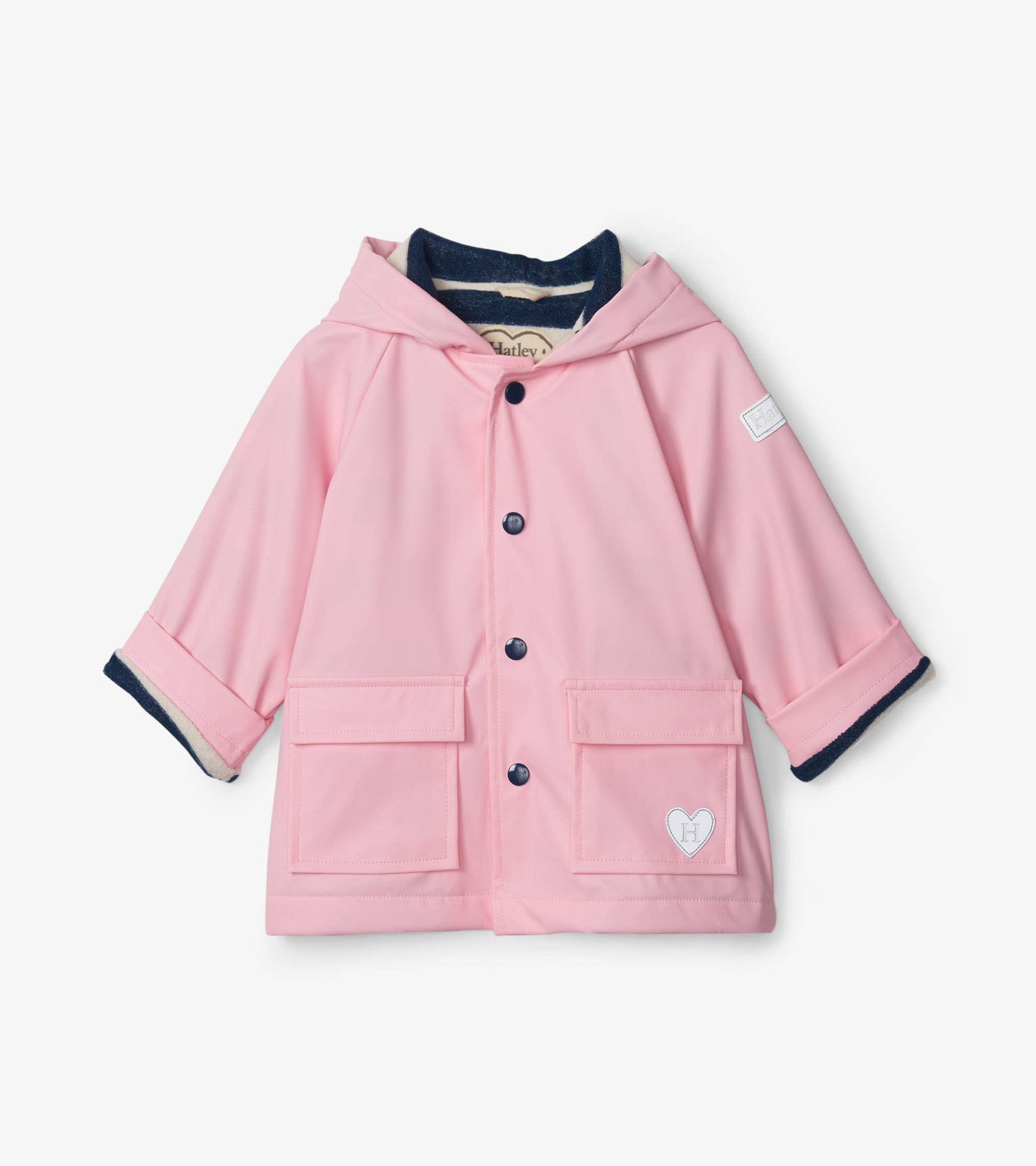 Light pink baby raincoat with a hood, navy trim, and front pockets, designed for infants aged 9-24 months.