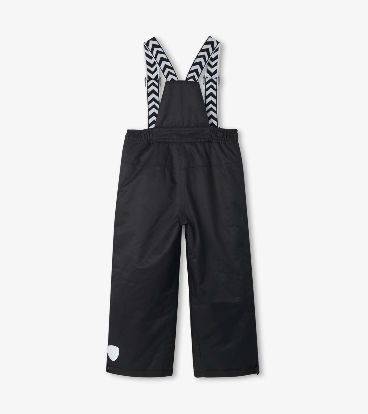 Black snow pants for kids with adjustable chevron-patterned straps and a relaxed fit, suitable for winter activities.