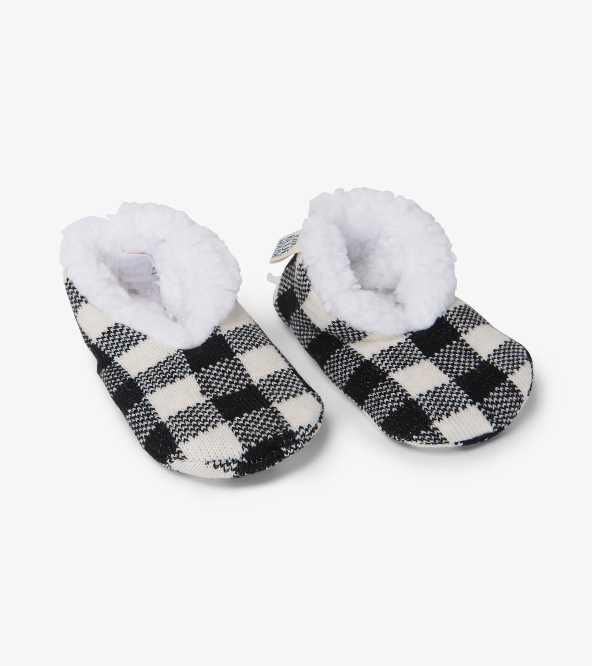Cream plaid kids' slippers with a cozy white faux fur lining, designed for warmth and comfort.