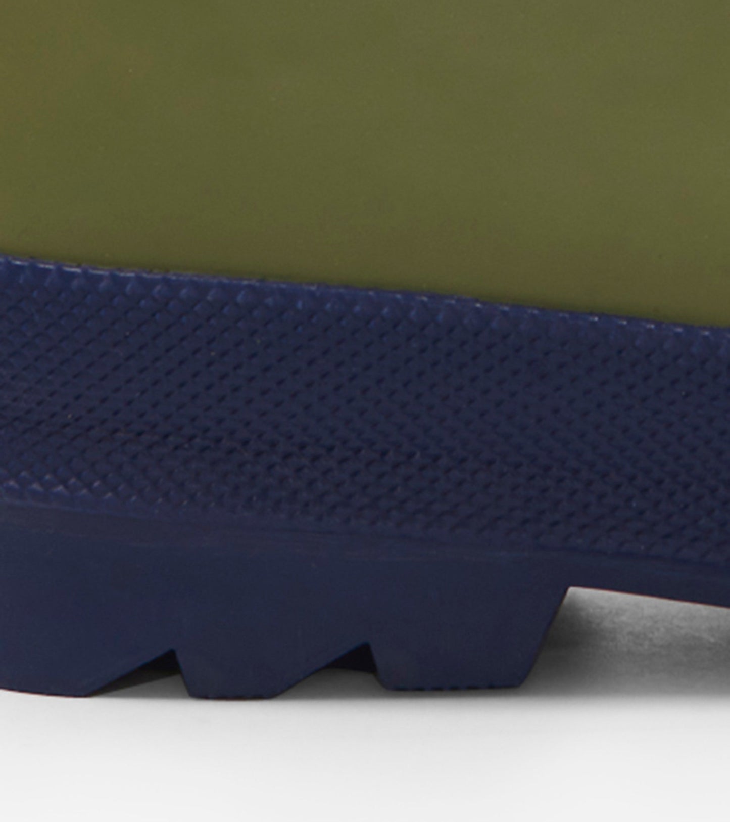 Forest green matte rain boots with a textured navy sole, designed for kids. Ideal for wet weather adventures.