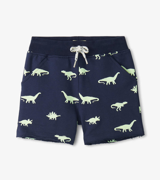 Navy pull-on shorts featuring a playful dinosaur pattern in light green, with an elastic waistband and side pockets.