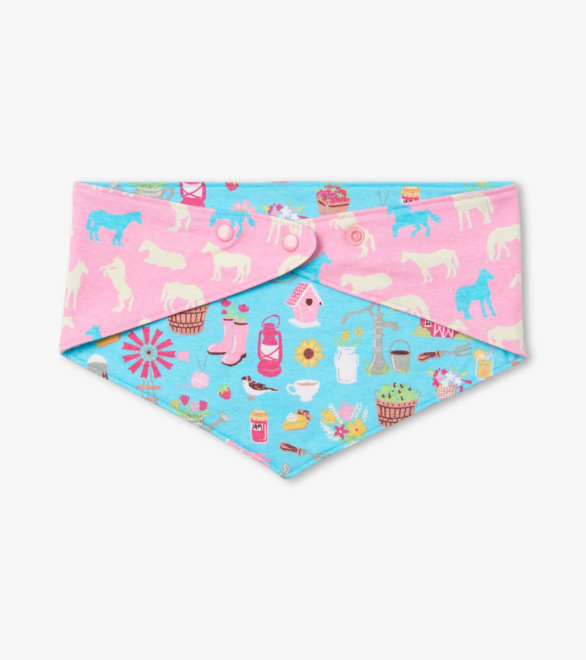 Reversible dog bandana featuring a pink side with white animals and a blue side with colorful country-themed patterns.