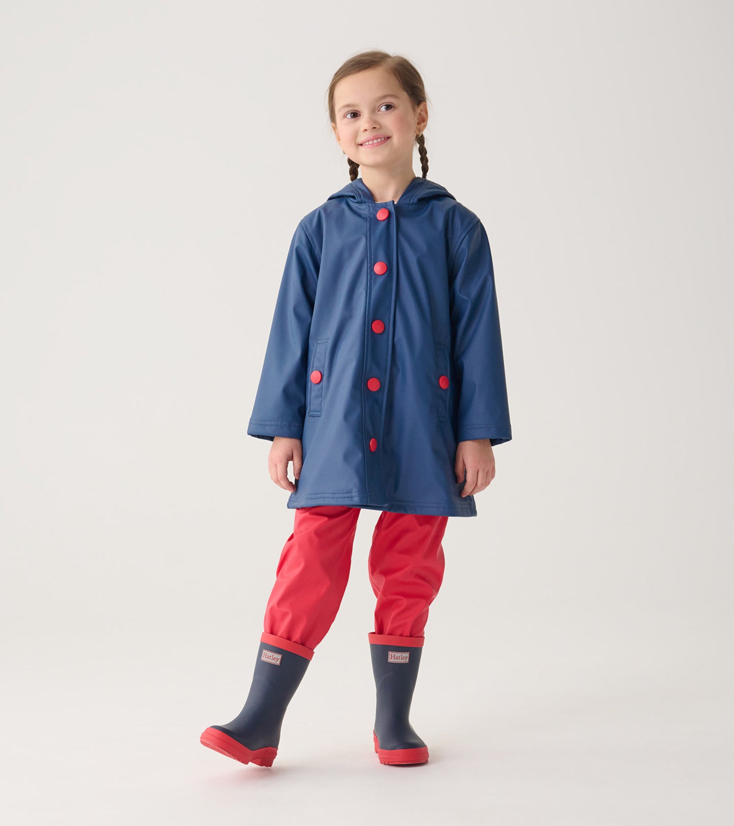 Navy and red matte rain boots for kids, featuring a sturdy design suitable for wet weather.