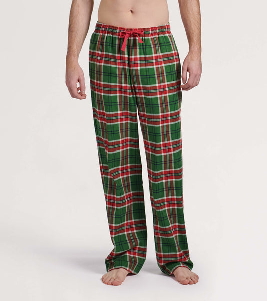 Green flannel pajama pants with a red and white plaid pattern, featuring an elastic waistband and drawstring.