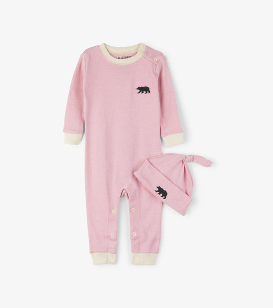 Pink baby sleeper with long sleeves and bear embroidery, paired with a matching knotted hat. Soft cotton material.