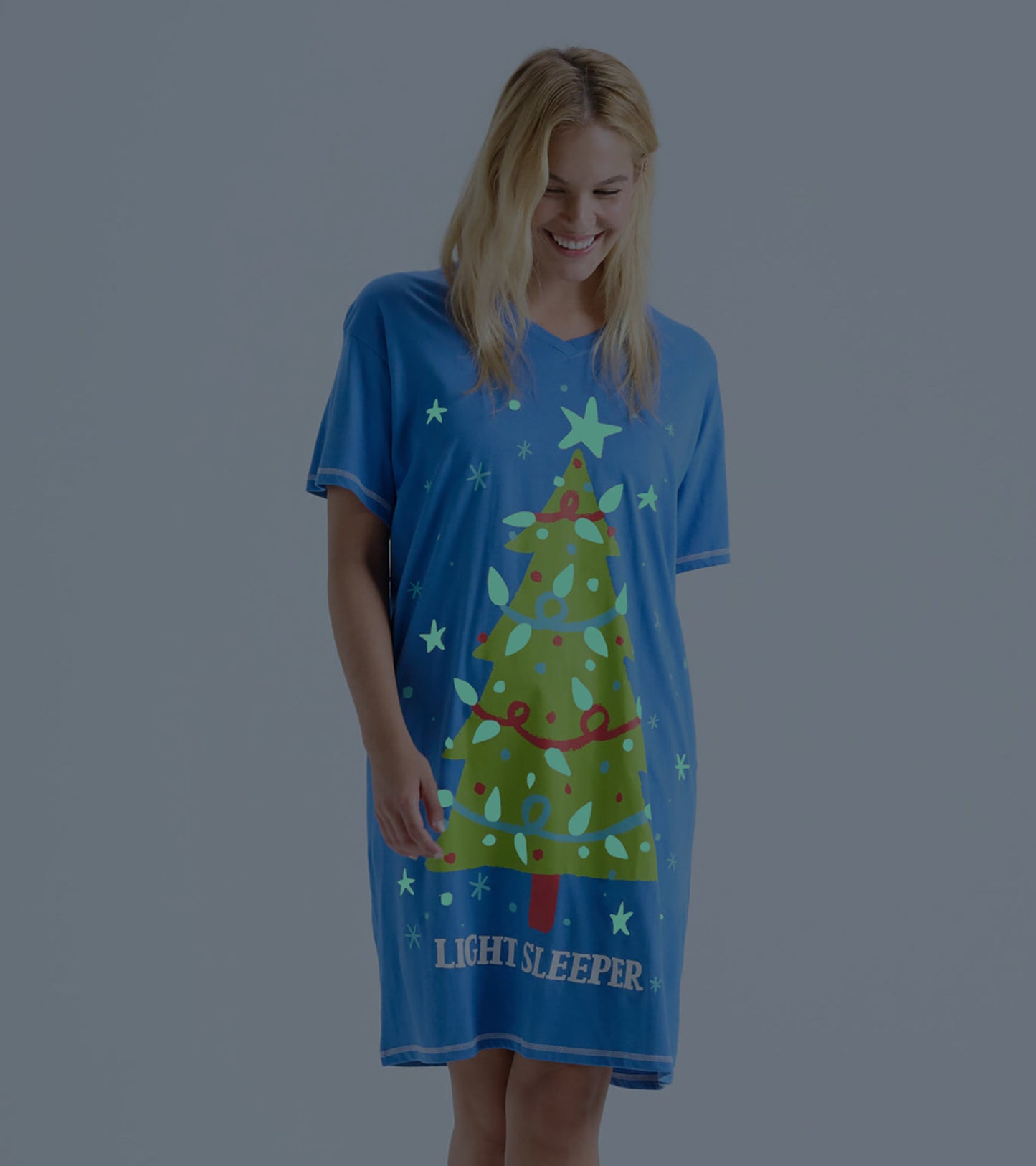 Blue short-sleeve sleepshirt featuring a colorful Christmas tree and star design, ideal for comfortable nighttime wear.