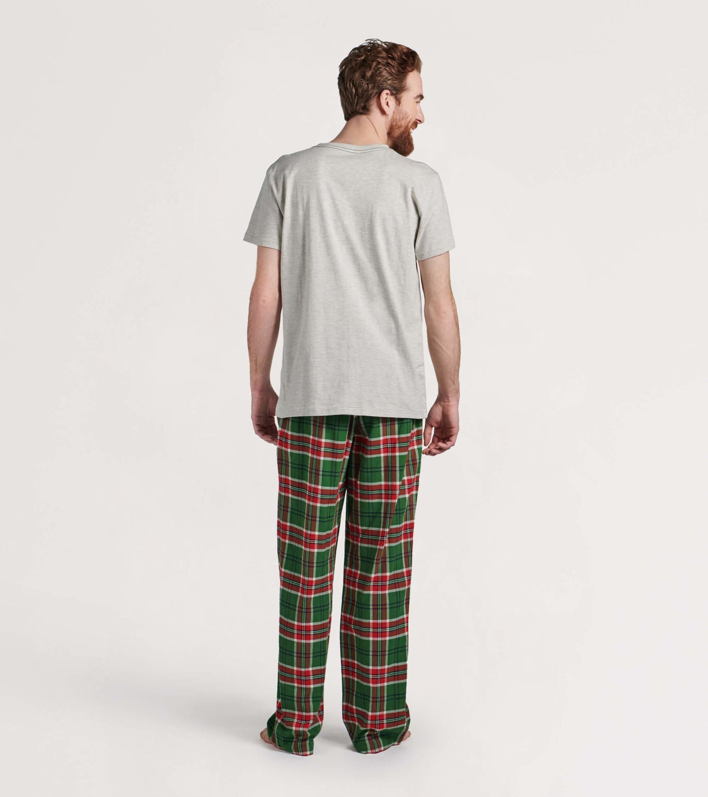 Men's flannel pajama pants featuring a green and red plaid pattern, relaxed fit, perfect for cozy holiday lounging.