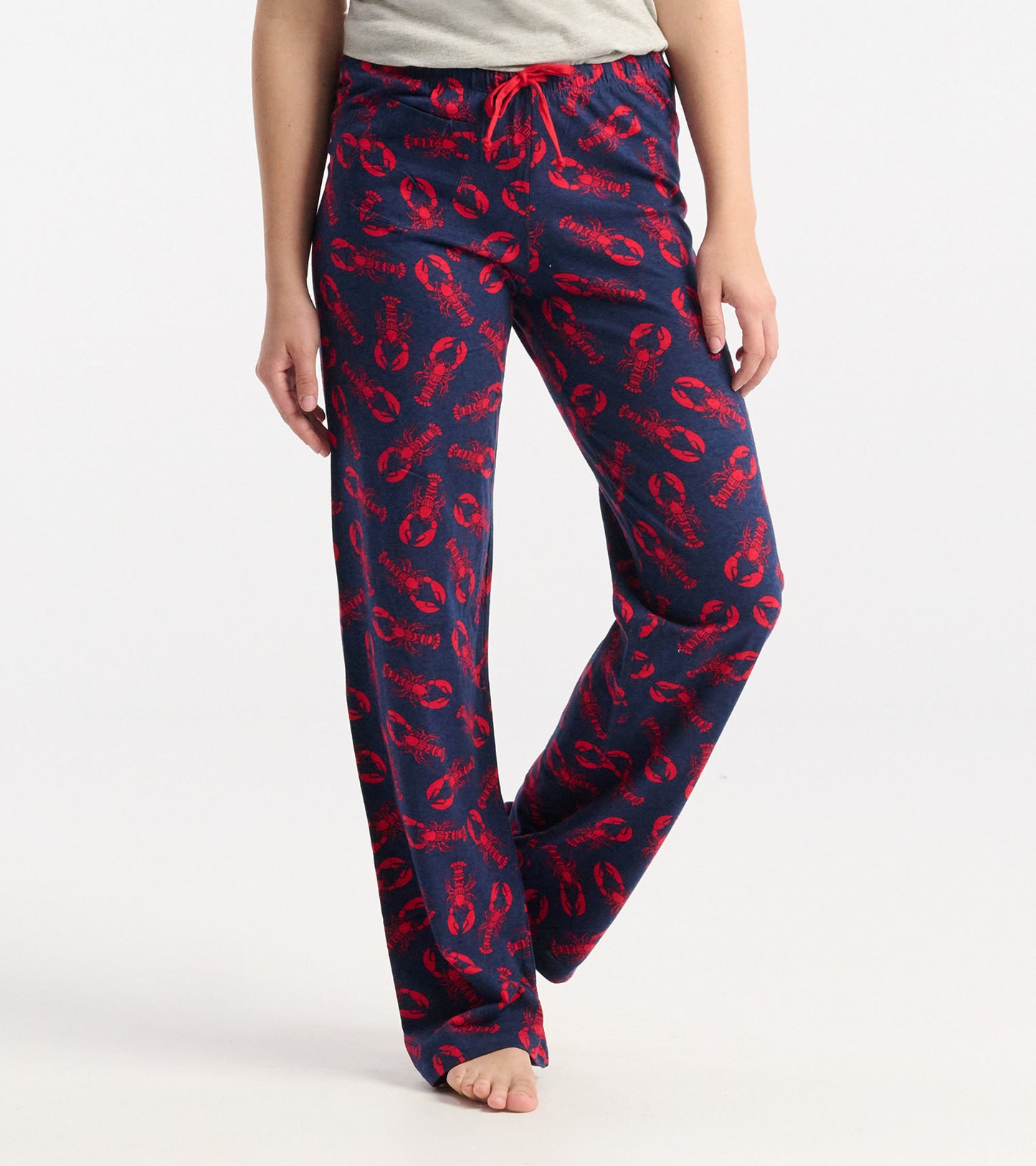 Navy cotton pajama pants featuring a red lobster pattern and an elastic waistband with a drawstring.