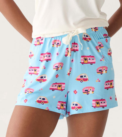 Light blue pajama shorts with pink camper print, elastic waistband, white drawstring, and side pocket, front view