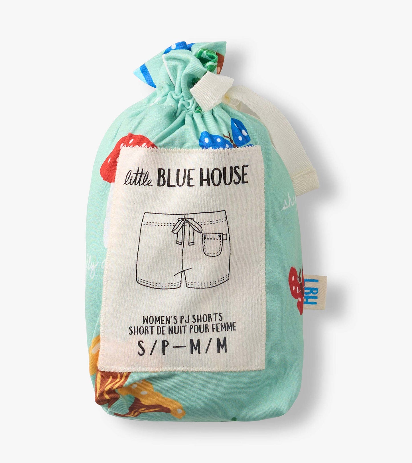 Folded mint green pajama shorts with colorful mushroom print and drawstring pouch packaging