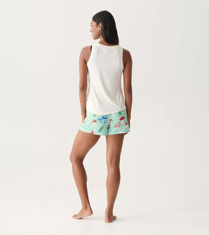 Mint green pajama shorts with colorful mushroom print, shown on a model from the back.