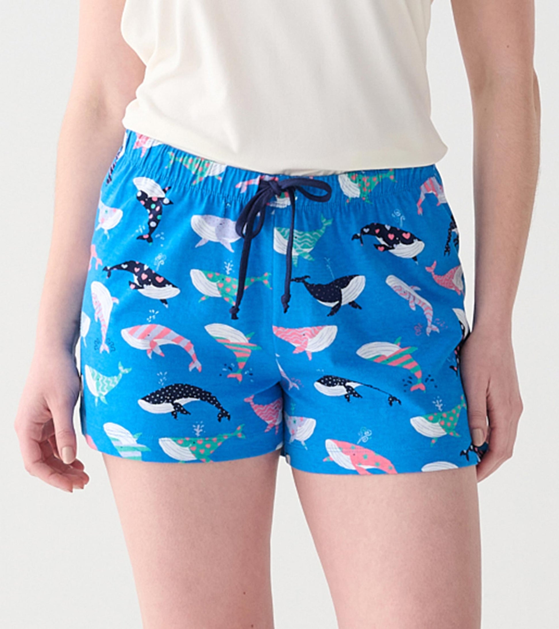 Women's blue boxer shorts with multicolored whale print, elastic waistband, and navy drawstring