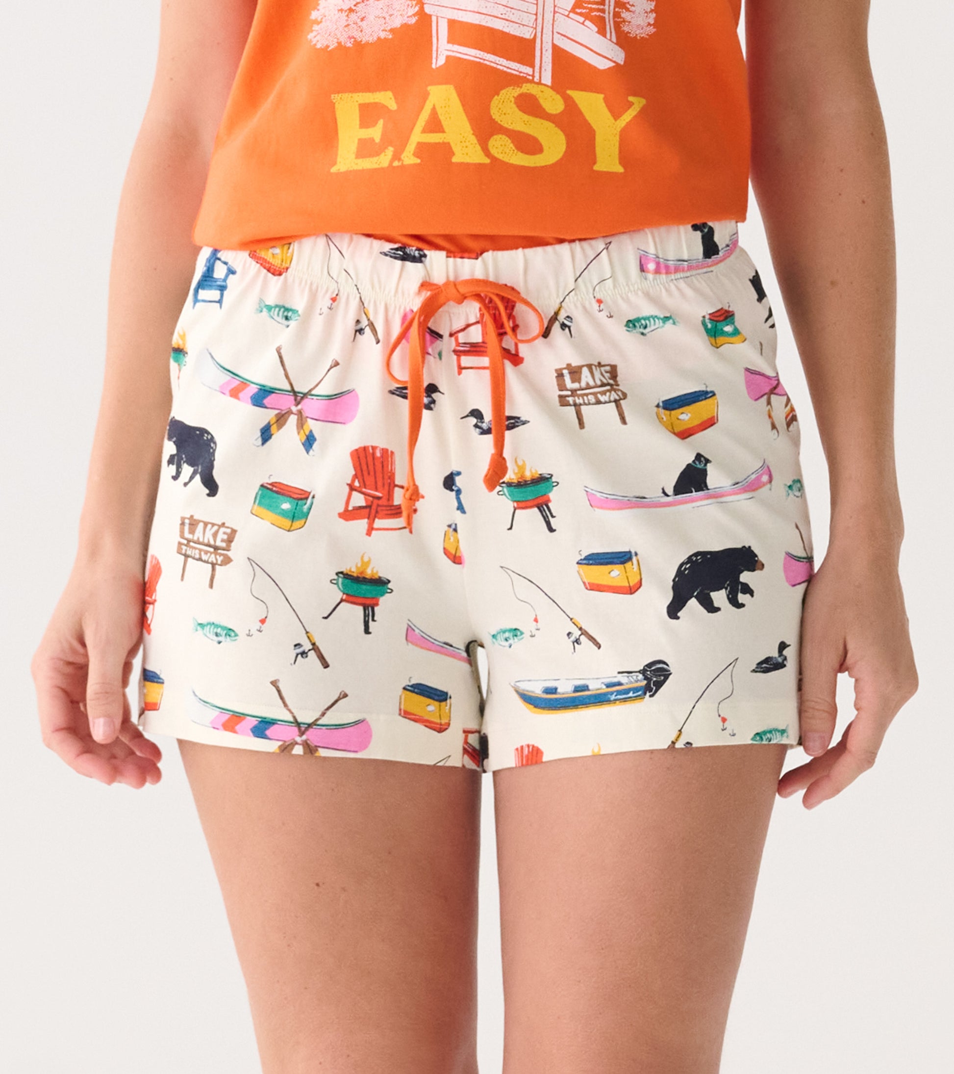 White cotton sleep shorts with colorful lake-themed print and orange drawstring, front view